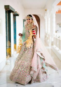 a woman in a wedding dress holding a bouquet