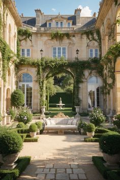 a large building with lots of windows and plants