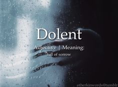 a person's hand on the window with rain drops all over it and text that reads dolemt