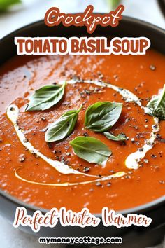 a bowl filled with tomato basil soup on top of a table