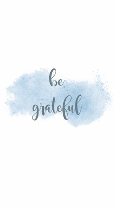 the words be grateful written on a blue watercolor background with white and gray ink