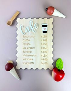 a wooden sign that says cake and two different types of food