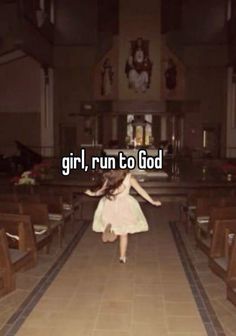 a girl in a white dress running down a church aisle with her arms spread out