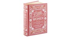 a pink book with the words little women written on it