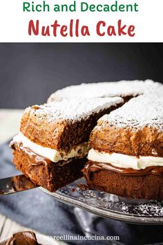 a chocolate cake with white frosting and nutella on top is cut in half