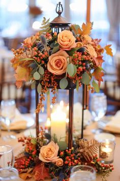 a lantern with flowers and candles on it