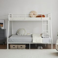 a white bunk bed sitting in a bedroom next to a dresser with drawers on it