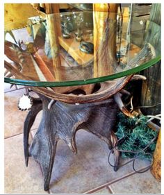 a glass table with antlers on it