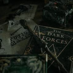 the dark forces book laying on top of other books