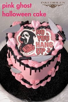 a pink and black cake with a knife in the shape of a heart that says, pink ghost halloween cake no you hang up