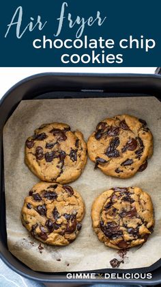 four chocolate chip cookies sitting on top of a baking pan with text overlay that reads air fryer chocolate chip cookies