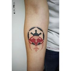 a ladybug tattoo on the right arm