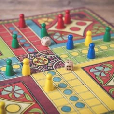 a close up of a board game with dices and pieces on the board,