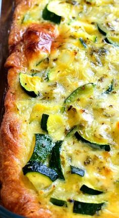 a casserole dish with zucchini and cheese