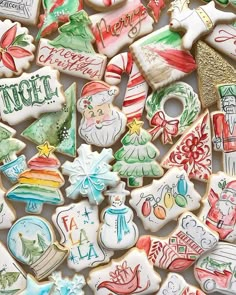 many decorated christmas cookies are displayed together