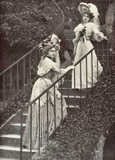 an old photo of two women on the stairs