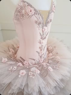 a pink ballet dress with flowers on it