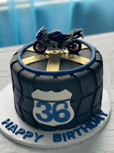 a birthday cake with a motorcycle on top