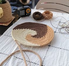 the table is covered with different types of yarn