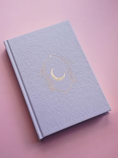 This journal is more than just a planner--it's a tool designed to help you cultivate mindfulness, build positive habits, and nurture your personal growth. By following the lunar cycles, you'll learn to align with the natural ebb and flow of energy. Whether you're new to journaling or a seasoned writer, this planner is here to inspire and support you on every step of your journey. The Moon has been a source of inspiration, mystery, and guidance for centuries, and now it's your turn to harness its Moon Date, Moon Journal, Holiday Offer, Ebb And Flow, Lunar Cycle, Dotted Page, Positive Habits, Time Design, Gold Gilding