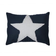 a blue and white pillow with a star on it