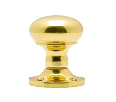 a golden door handle on a white background