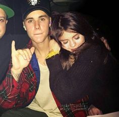 two men and a woman are posing for a photo in front of the camera with their thumbs up