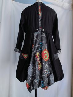 "Wearable art coat Loaded with detail. It's fashioned in an abstract 19th Century style. Features: * tailored bodice with flounced skirt * embroidery and patchwork throughout * metal crest buttons down the sleeves, down the front and on the waist in the back * drawstring neck, hem and pockets * metal gromets on the pockets Made by ANIMALE, Size Small. Measurements, laying flat: 15\" across shoulders 18\" underarm to underarm 17\" across waist 27.5\" across bottom hem 34\" length in front, 40\" l Artistic Black Outerwear For Fall, Artistic Fitted Long Sleeve Outerwear, Artistic Black Long Sleeve Outerwear, Black Bohemian Patchwork Outerwear, Bohemian Black Outerwear With Patchwork, Bohemian Black Patchwork Outerwear, Black Bohemian Cotton Outerwear, Sewing Upcycle, Art Coat