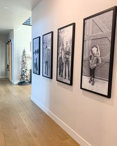 three black and white pictures hanging on the wall