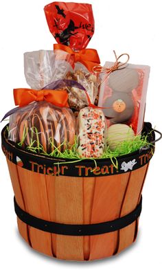 a wooden basket filled with lots of treats