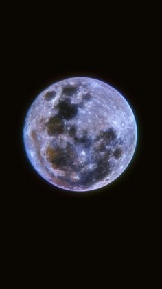 the full moon is seen in the dark sky