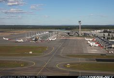 an airport with several planes parked on the tarmac