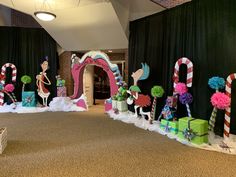 a decorated entrance with candy canes and decorations