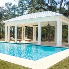 a pool with a covered patio next to it