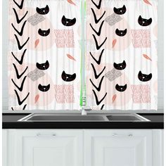 a kitchen window curtain with black cats on pink and white curtains in front of a sink