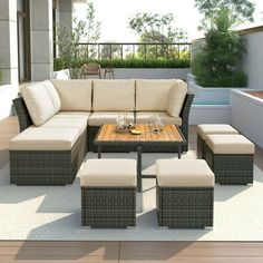 an outdoor living room with furniture on the patio