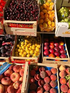 many boxes of fruit are stacked on top of each other