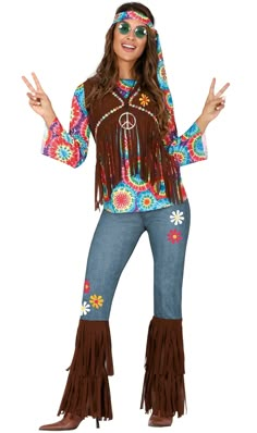 a woman in a hippie costume posing with her hands out and wearing sunglasses on