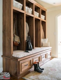 a wooden bench sitting in the middle of a room