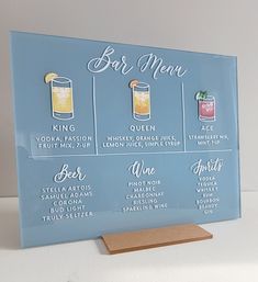 a blue glass sign with different types of drinks on it and the words bar menu