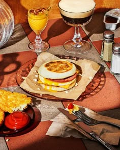 a table topped with plates of food and drinks