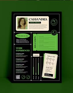 a green and black poster with some writing on it's back side, along with other items