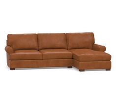 a brown leather sectional sofa sitting on top of a white floor