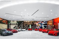 a large room filled with lots of different colored cars