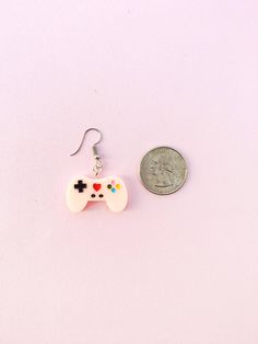 --------------------------------------Hello Fellow Aliens!--------------------------------------------- CHECK OUT OUR COOL OFFERS: ~ Spend $35 and get free shipping! ~ Buy 4 patches in our shop and get a 5th patch of equal or lesser value free! -------------------------------------------------------------------------------------------------------------These adorable game controller earrings will look great with your cute outfit. Resin controller comes in several colors and buttons are painted in Quirky Pink Jewelry Gift, Nerd Earrings, Mana Potion, School Earrings, World Of Warcraft Game, Shrinky Dink Jewelry, Purple Games, House Project Ideas, Computer Nerd