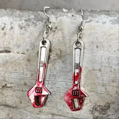 Very Cool And Stunning Wrench Dangle Earrings. They Are Silver In Color With Red Markings That Resemble Blood On The Wrench Length Of Earring: 1.5 Inches (Approximate) Height Of The Pendant: 1.2 Inches (Approximate) Width Of The Pendant: 0.5 Inches (Approximate) Weight: 0.5 Ounces Fashion Jewelry, Boho Jewelry, Hippie Jewelry, Handmade Jewelry, Unique Earrings, Indian Jewelry, Silver Earrings, Gift For Her, Tribal Jewelry Shipping This Item Is Ready To Ship Within 1-2 Business Days From The Time Haunted Apartment, Skull Earring, Creepy Earrings, Cowboy Valentines, Weird Earrings, Weird Jewelry, Funny Earrings, Earrings Gothic, Cool Earrings