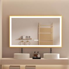 a bathroom with two sinks and a large mirror over it's counter top area