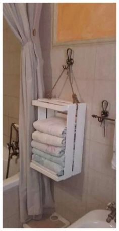 a towel rack in the corner of a bathroom