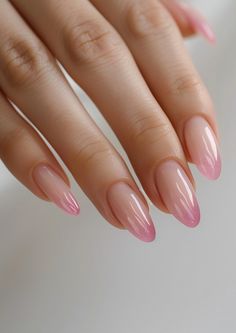 Elevate your nail game with these glossy ombre pink almond nails. Perfect for adding a touch of femininity to your look. Find your next nail inspiration on NailHow.com and let your hands do the talking! Blush Nails Almond Shape, Clean Almond Nails Designs, Nail Inspo Almond Ombre, Natural Sns Nails Almond, Nail Design Trend 2024, Pink Tip Manicure, Glossy Nails Pink, Dusty Pink Almond Nails, Pink Feminine Nails