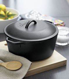 a cast iron skillet sitting on top of a cutting board